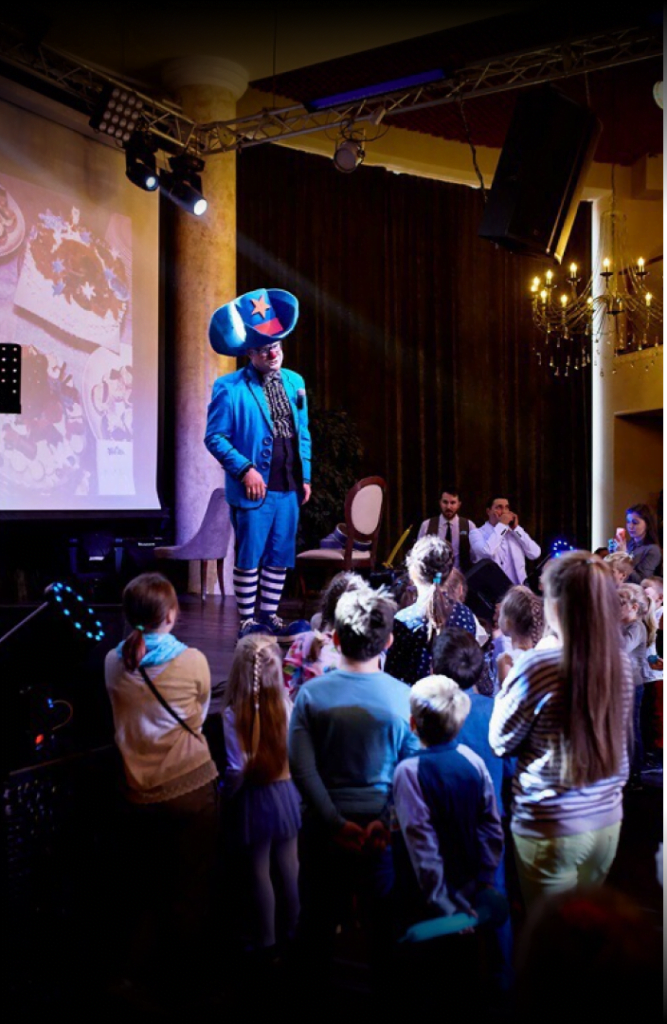 wladimir magic with a hat on performing in front of kids